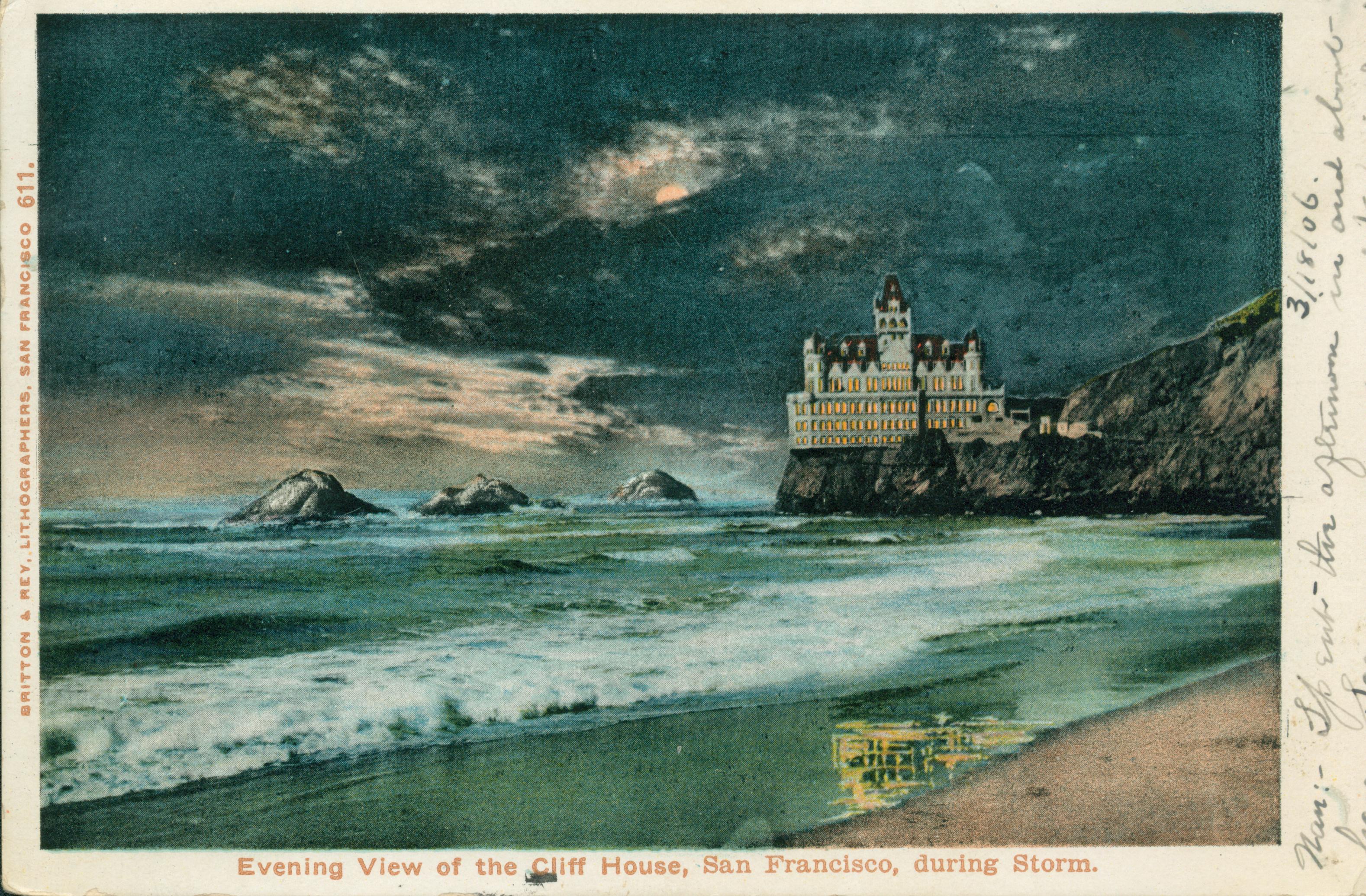 Shows the Cliff House and Seal Rocks at night with the beach in the foreground.